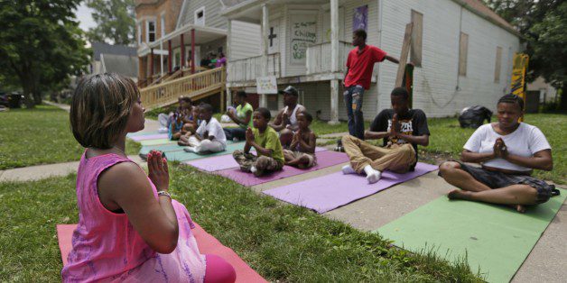 Yoga in front of The Peace House. Growing Peace. The Brave Files Podcast.