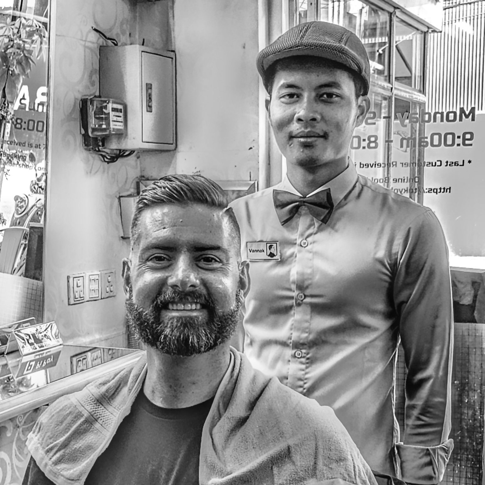 Matt at a barber shop in Cambodia.